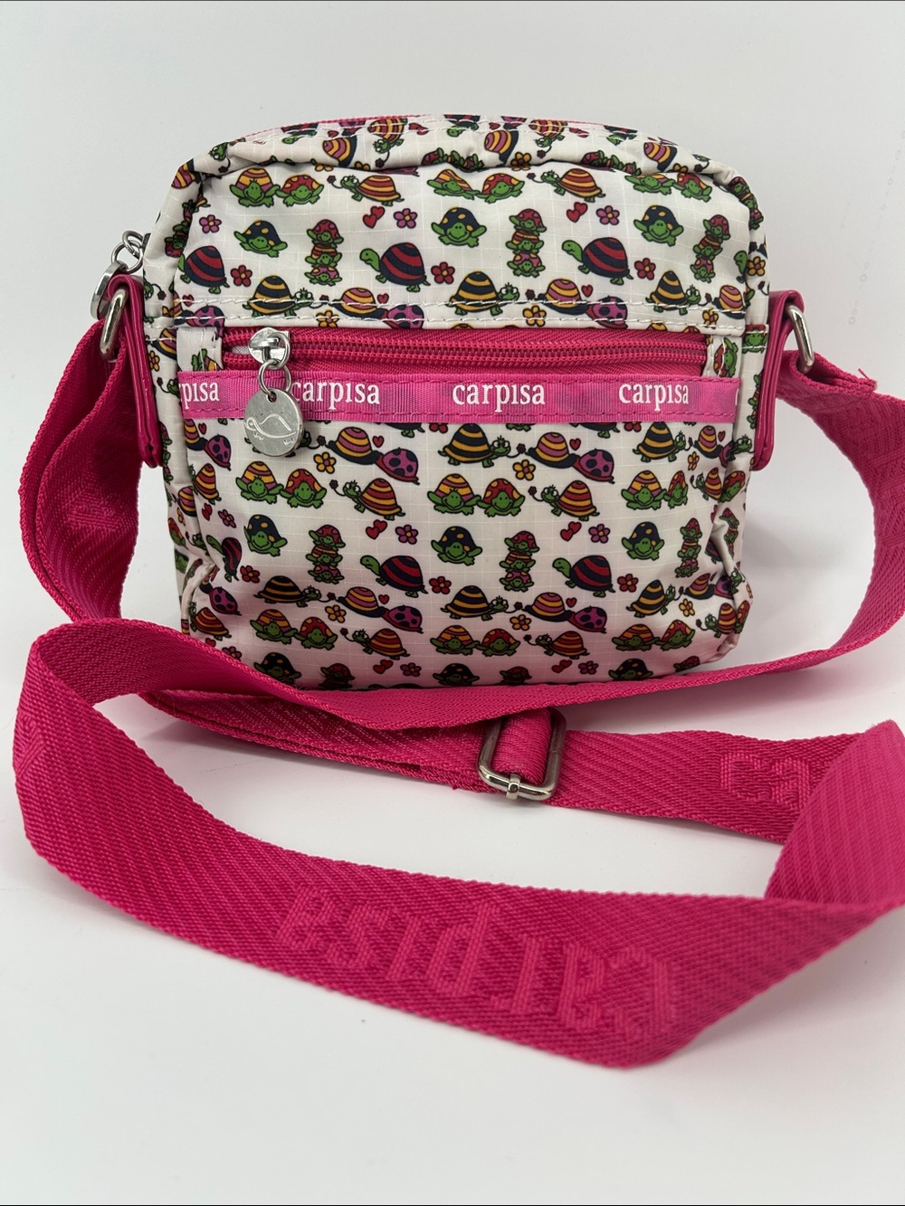 Carpisa Turtle Lovers  print crossbody handbag in white & pink Lightweight